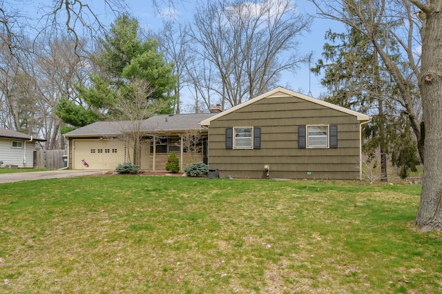 419 Larkspur Ave, Portage, MI 49002 - single story home featuring a garage, driveway, a front yard, and fence