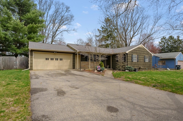 419 Larkspur Ave, Portage, MI 49002 - ranch-style home featuring a garage, driveway, a front lawn, and fence