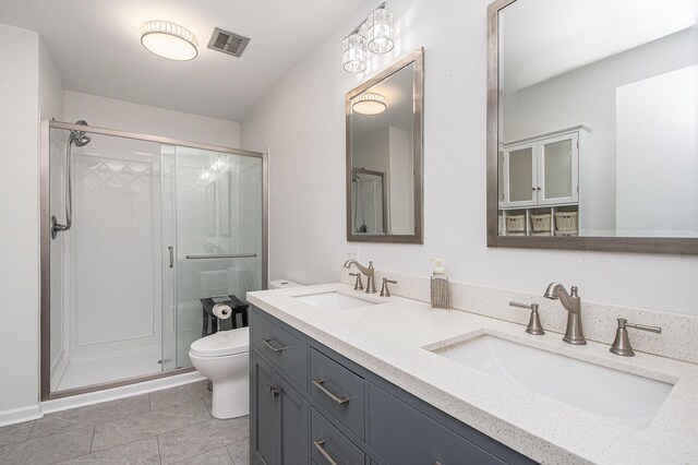 2420 E Collier Ave SE, Grand Rapids, MI 49546 - bathroom featuring toilet, a stall shower, a sink, and visible vents