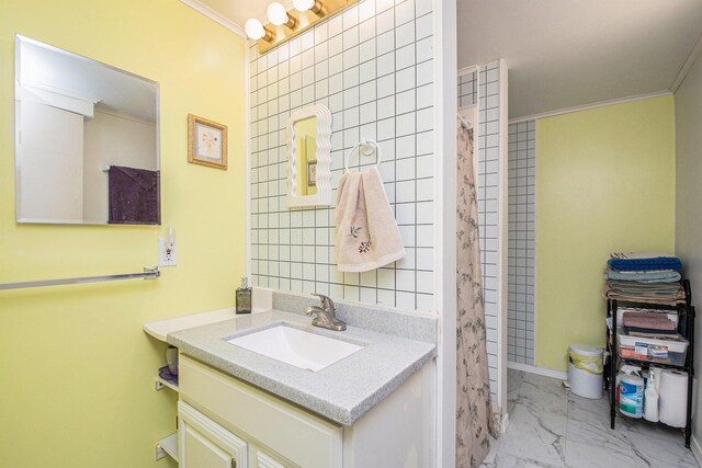 2420 E Collier Ave SE, Grand Rapids, MI 49546 - full bathroom with vanity, ornamental molding, and marble finish floor