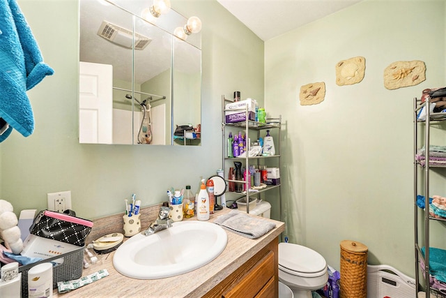 103 S Leeth St, White Pigeon, MI 49099 - bathroom featuring toilet, walk in shower, vanity, and visible vents