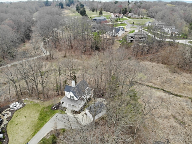 drone / aerial view featuring a view of trees