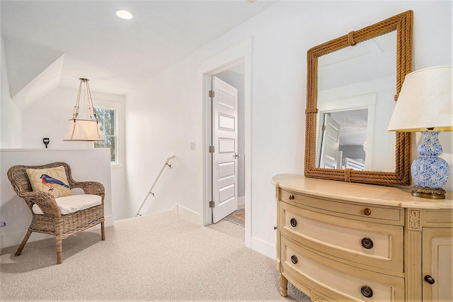 sitting room featuring baseboards, an upstairs landing, and recessed lighting