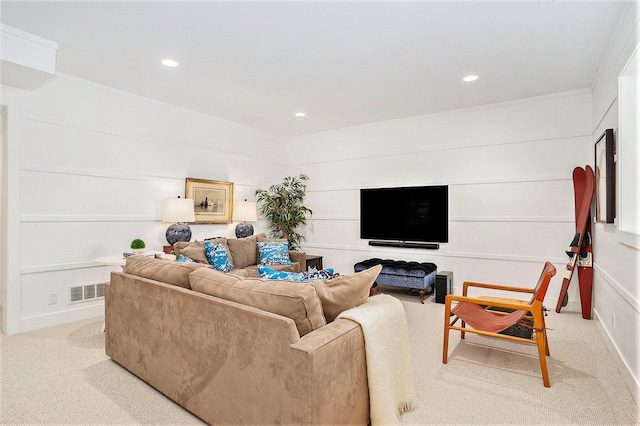 living area featuring recessed lighting, visible vents, crown molding, and light carpet