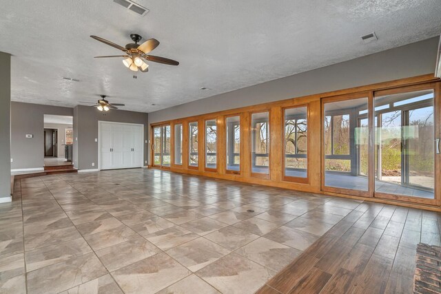11886 Riverside Dr, White Pigeon, MI 49099 - unfurnished room featuring plenty of natural light, baseboards, visible vents, and ceiling fan