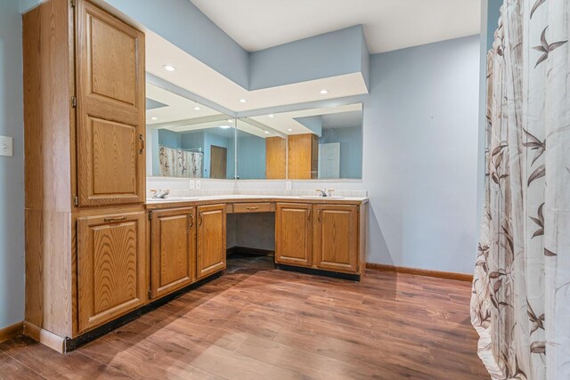 11886 Riverside Dr, White Pigeon, MI 49099 - full bath featuring baseboards, wood finished floors, and a sink