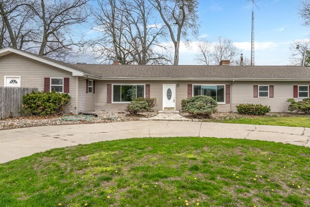 11886 Riverside Dr, White Pigeon, MI 49099 - ranch-style house with a chimney, fence, and a front yard