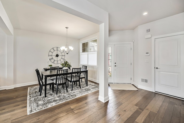dining room featuring baseboards, visible vents, a chandelier, recessed lighting, and dark wood-type flooring