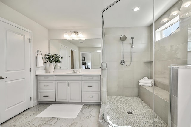 bathroom featuring recessed lighting, a shower stall, marble finish floor, and vanity