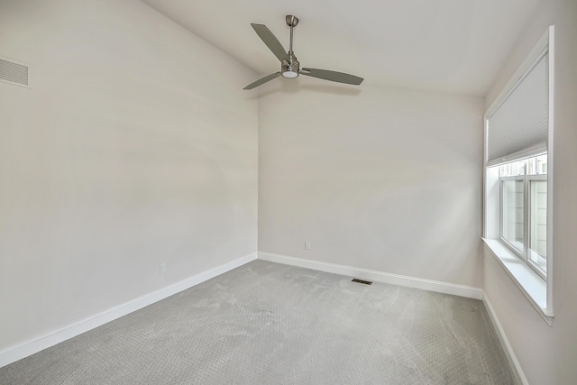 empty room with visible vents, baseboards, carpet floors, and ceiling fan