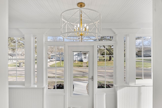 doorway featuring wooden ceiling and an inviting chandelier