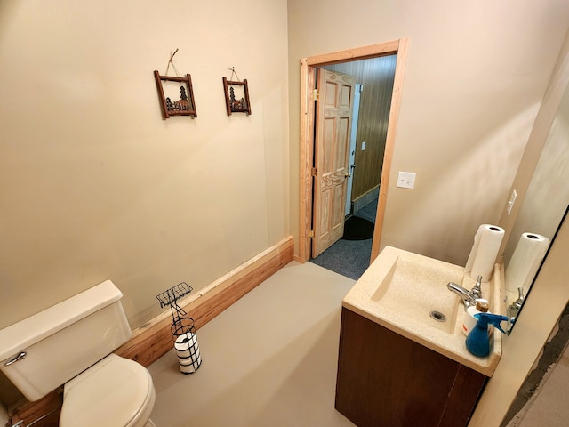 6039 W Morris Lake Rd, Mears, MI 49436 - bathroom with baseboards, vanity, and toilet
