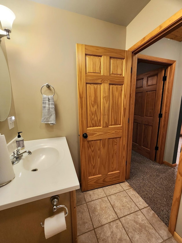 6039 W Morris Lake Rd, Mears, MI 49436 - bathroom with vanity and tile patterned flooring