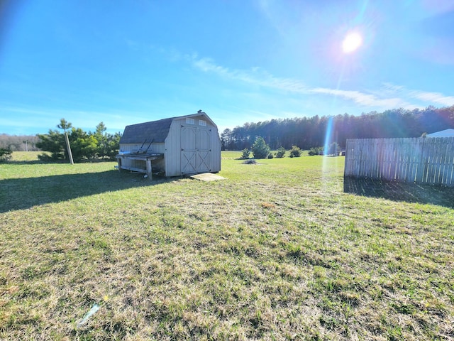 6039 W Morris Lake Rd, Mears, MI 49436 - view of yard with fence, an outbuilding, and a shed