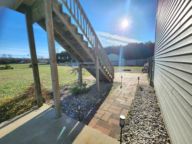 6039 W Morris Lake Rd, Mears, MI 49436 - view of patio / terrace featuring stairs and fence