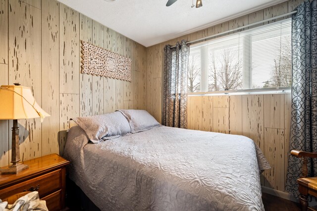 5505 Lakewood Dr, Coloma, MI 49038 - bedroom featuring wooden walls and ceiling fan