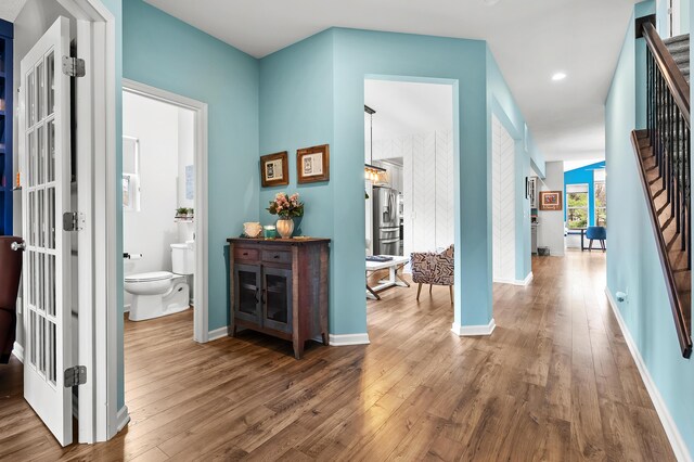 5849 Gavin Ln, Kalamazoo, MI 49009 - hallway featuring recessed lighting, wood finished floors, baseboards, and stairs
