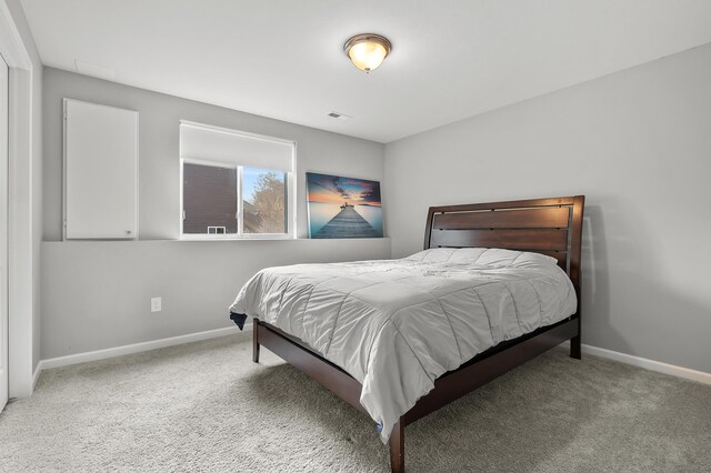 5849 Gavin Ln, Kalamazoo, MI 49009 - bedroom with baseboards, visible vents, and carpet