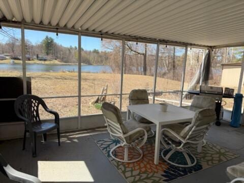 4605 Hunters Trl, Six Lakes, MI 48886 - sunroom / solarium with a water view, healthy amount of natural light, and outdoor dining area