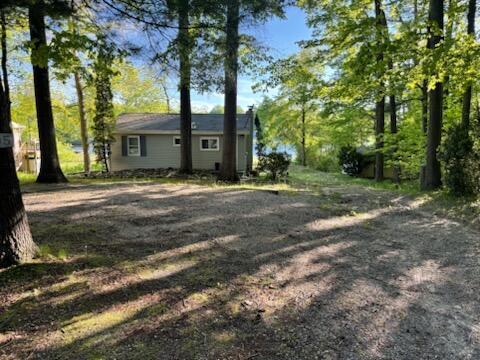 4605 Hunters Trl, Six Lakes, MI 48886 - view of yard