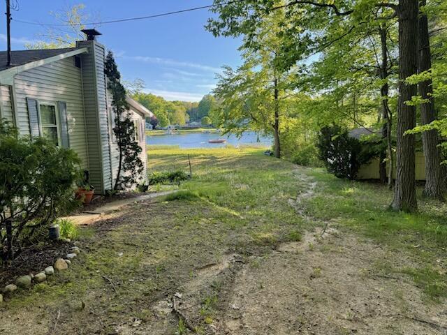 4605 Hunters Trl, Six Lakes, MI 48886 - view of yard featuring a water view