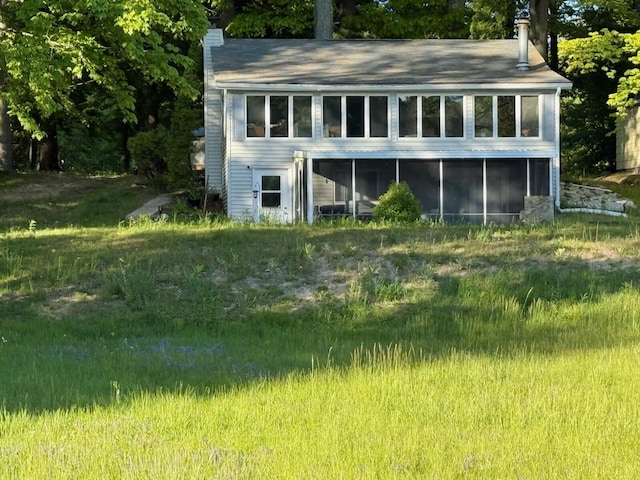 4605 Hunters Trl, Six Lakes, MI 48886 - back of property with a chimney