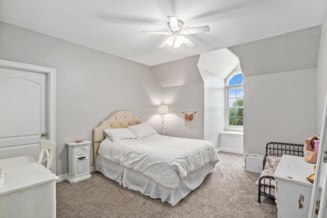 7812 Fountain Hills Ln, Davisburg, MI 48350 - bedroom featuring light colored carpet, lofted ceiling, baseboards, and a ceiling fan