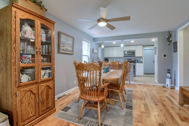 4790 Downing Dr, Pinckney, MI 48169 - dining space with ceiling fan, baseboards, and light wood-type flooring