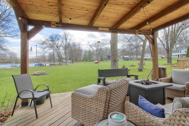 4790 Downing Dr, Pinckney, MI 48169 - wooden terrace with a yard and an outdoor living space with a fire pit