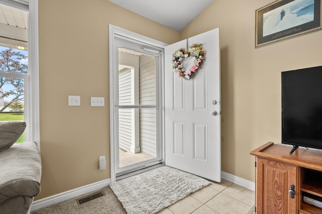 51441 Jordan St, Paw Paw, MI 49079 - foyer entrance featuring healthy amount of natural light, light tile patterned flooring, and lofted ceiling