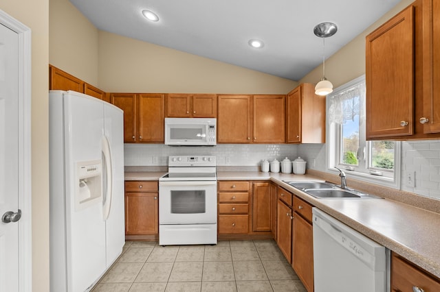 51441 Jordan St, Paw Paw, MI 49079 - kitchen with white appliances, brown cabinetry, backsplash, vaulted ceiling, and decorative light fixtures