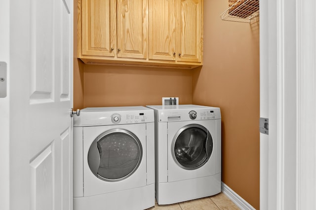 51441 Jordan St, Paw Paw, MI 49079 - laundry room with washer and clothes dryer, cabinet space, and light tile patterned floors
