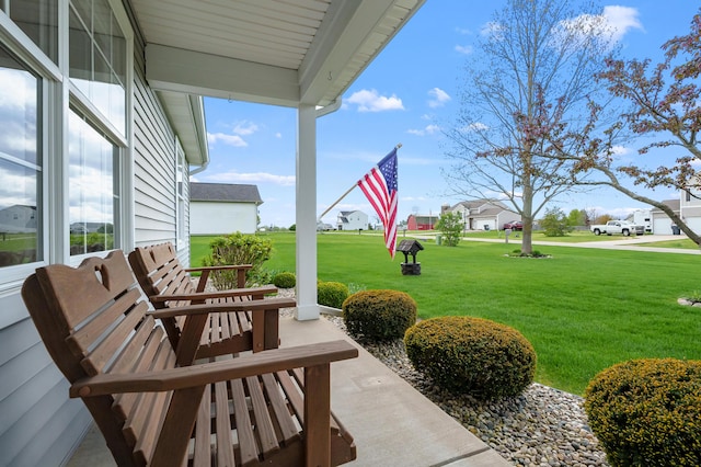 51441 Jordan St, Paw Paw, MI 49079 - covered porch with a yard and a residential view