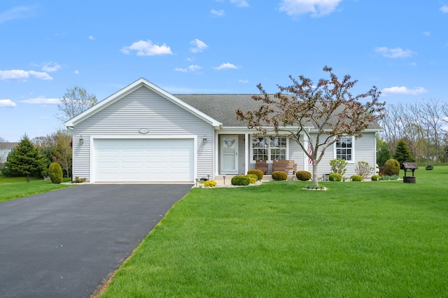 51441 Jordan St, Paw Paw, MI 49079 - single story home featuring asphalt driveway, a garage, a front yard, and roof with shingles