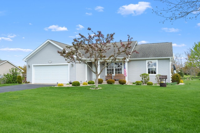 51441 Jordan St, Paw Paw, MI 49079 - view of front of house with driveway, a garage, a front lawn, and roof with shingles