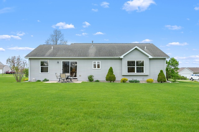 51441 Jordan St, Paw Paw, MI 49079 - back of house featuring a patio, a lawn, and roof with shingles