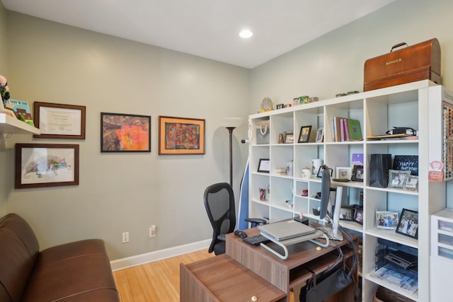 office space with baseboards, wood finished floors, and recessed lighting