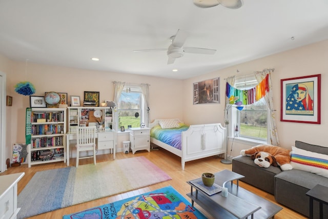 bedroom with wood finished floors and a ceiling fan