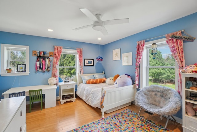 bedroom featuring recessed lighting, light wood-style flooring, and a ceiling fan