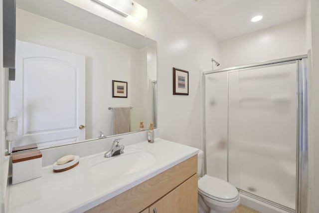 full bathroom with vanity, recessed lighting, a shower stall, and toilet