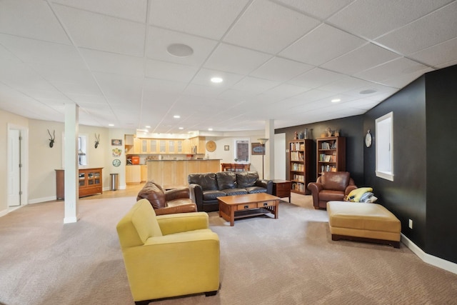 living room with recessed lighting, a drop ceiling, baseboards, carpet flooring, and bar