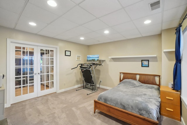 carpeted bedroom featuring recessed lighting, visible vents, french doors, baseboards, and a paneled ceiling