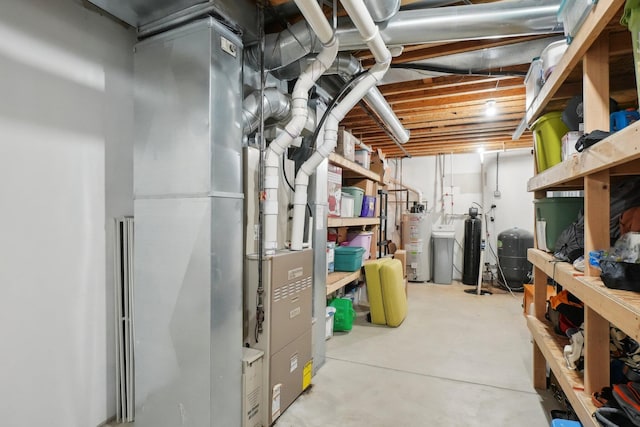 unfinished basement featuring water heater