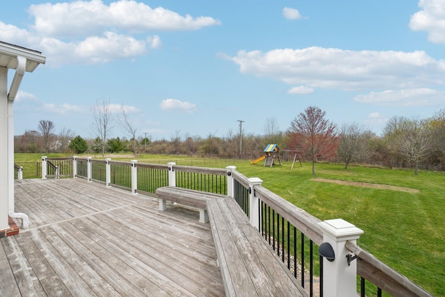 deck featuring a yard and a playground