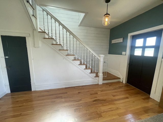 foyer with stairway and wood finished floors