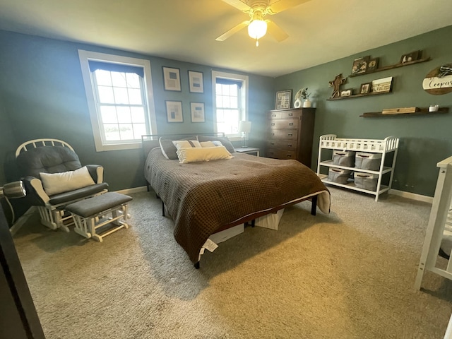 carpeted bedroom with baseboards and ceiling fan