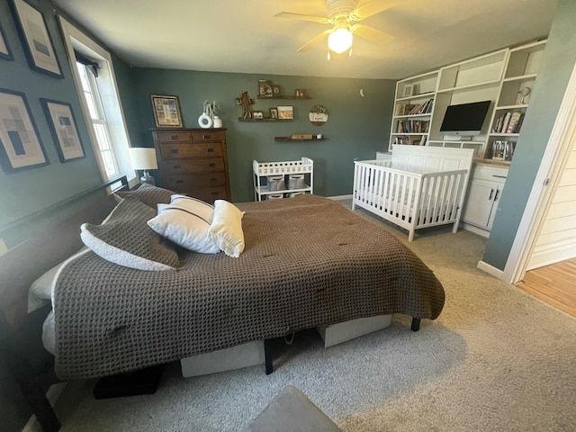 carpeted bedroom featuring baseboards