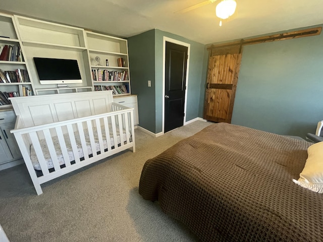 carpeted bedroom with a ceiling fan and baseboards