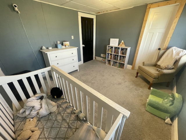 carpeted bedroom featuring baseboards