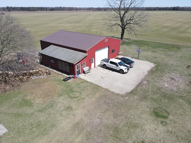birds eye view of property with a rural view